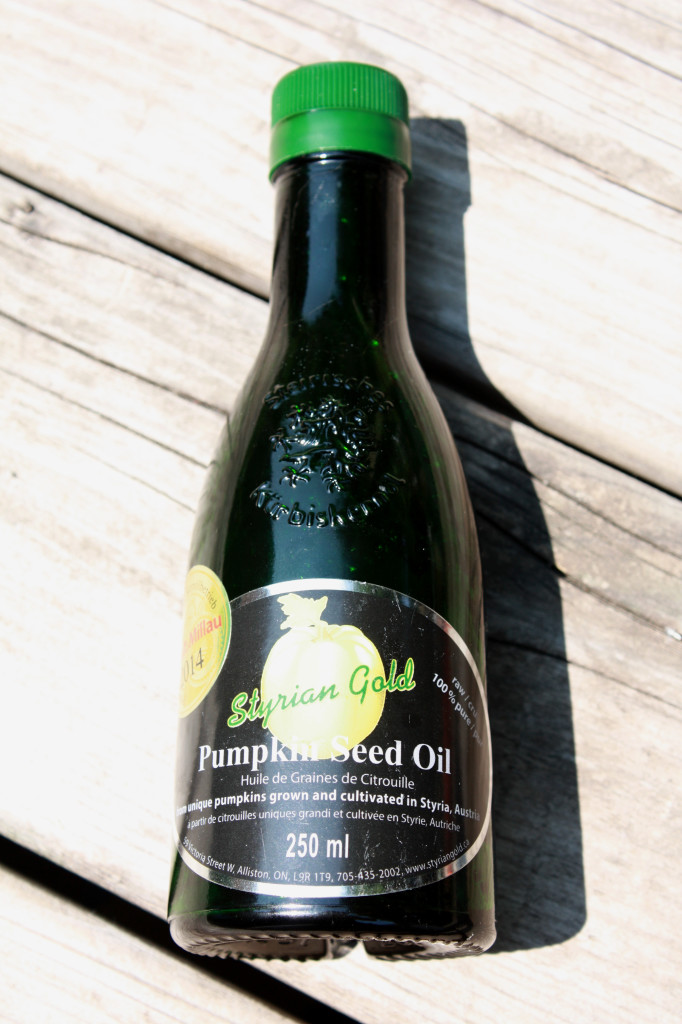 Beautiful dark green glass bottle of Styrian Gold Austrian pumpkin seed oil